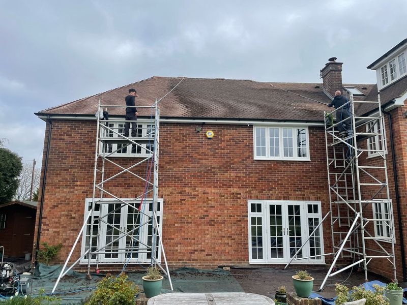 Roof cleaning carried out safely from scaffold towers by The Roof Moss Cleaners in Hertford